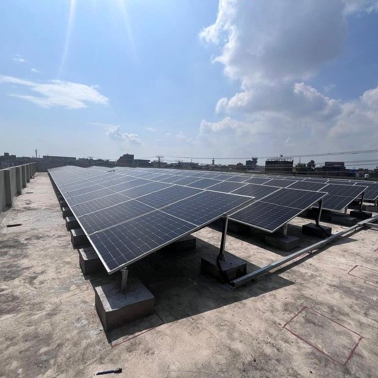 Tilted solar panels mounted on a flat concrete roof